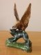Глиняная статуэтка "Борьба орла с волком" ручной работы